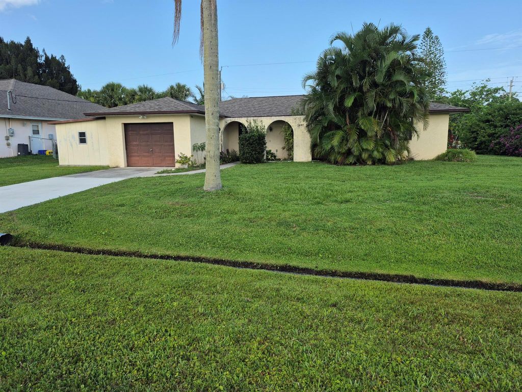 Photo of 2897 SW Ortega Street, Port Saint Lucie, FL 34953 (MLS # R11097412)