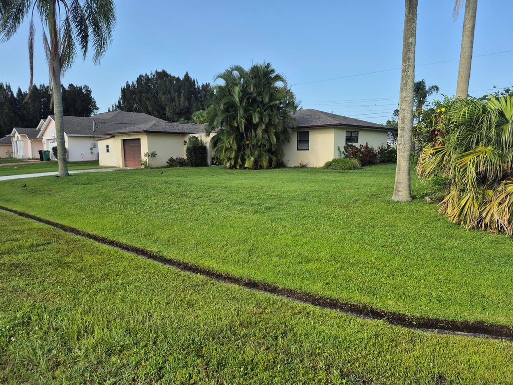Photo of 2897 SW Ortega Street, Port Saint Lucie, FL 34953 (MLS # R11097412)
