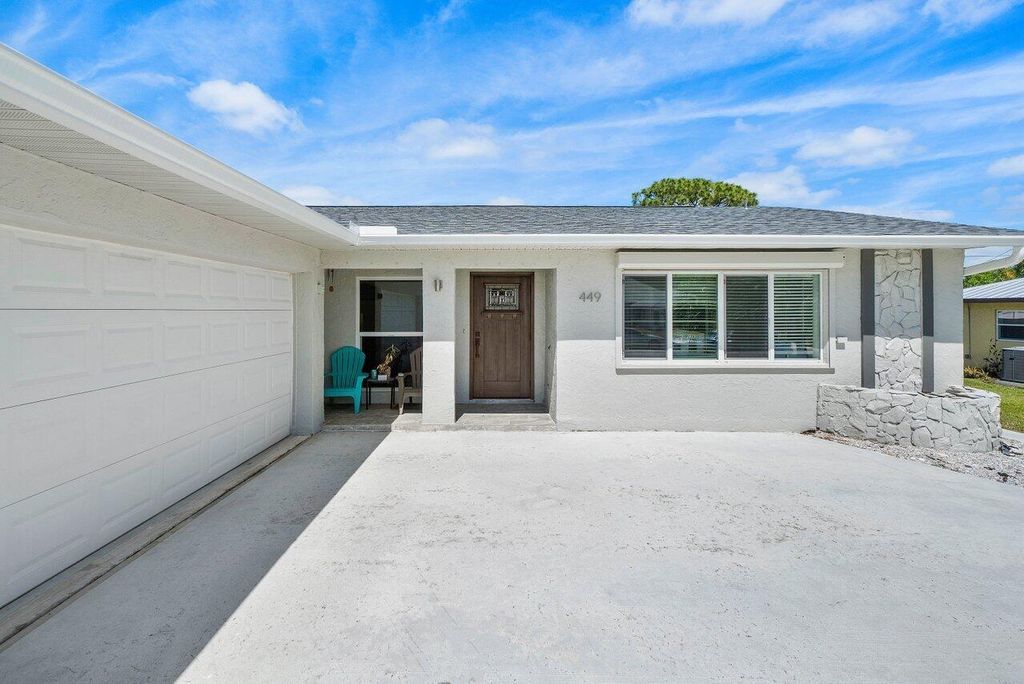 Photo of 449 SE Seabreeze Lane, Port Saint Lucie, FL 34983 (MLS # R10978447)