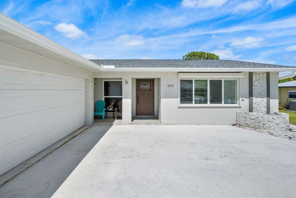 Photo of 449 SE Seabreeze Lane, Port Saint Lucie, FL 34983 (MLS # R10978447)