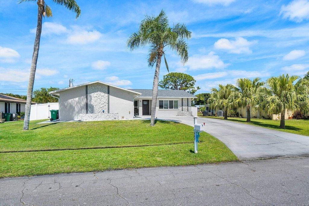 Photo of 449 SE Seabreeze Lane, Port St Lucie, FL 34983 (MLS # R10978447)