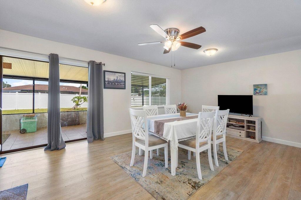 Photo of 449 SE Seabreeze Lane, Port Saint Lucie, FL 34983 (MLS # R10978447)