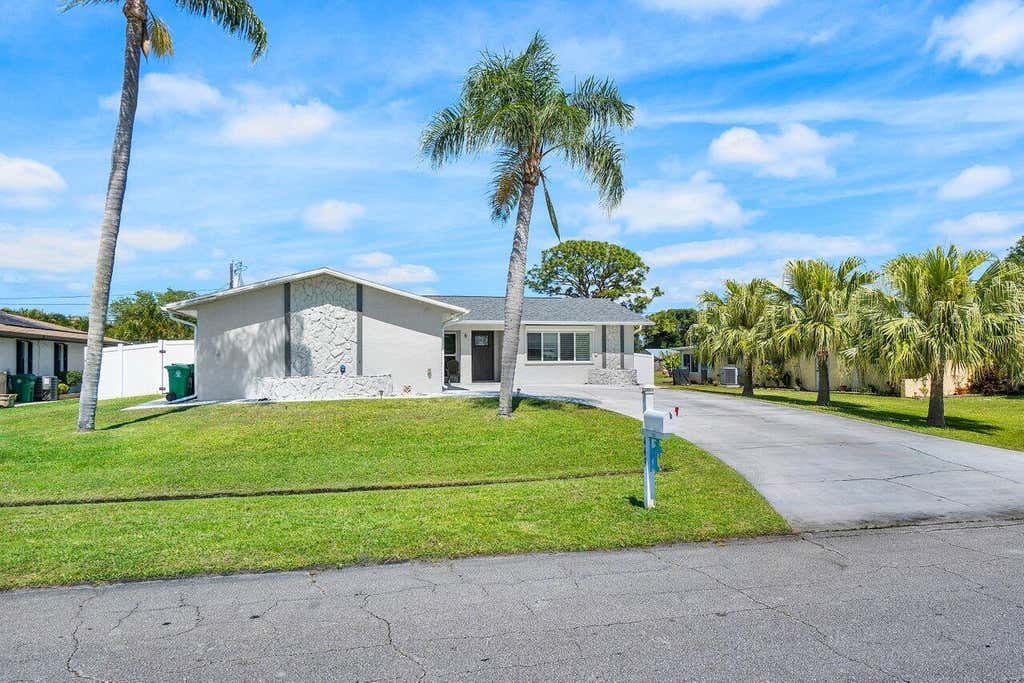 Photo of 449 SE Seabreeze Lane, Port Saint Lucie, FL 34983 (MLS # R10978447)