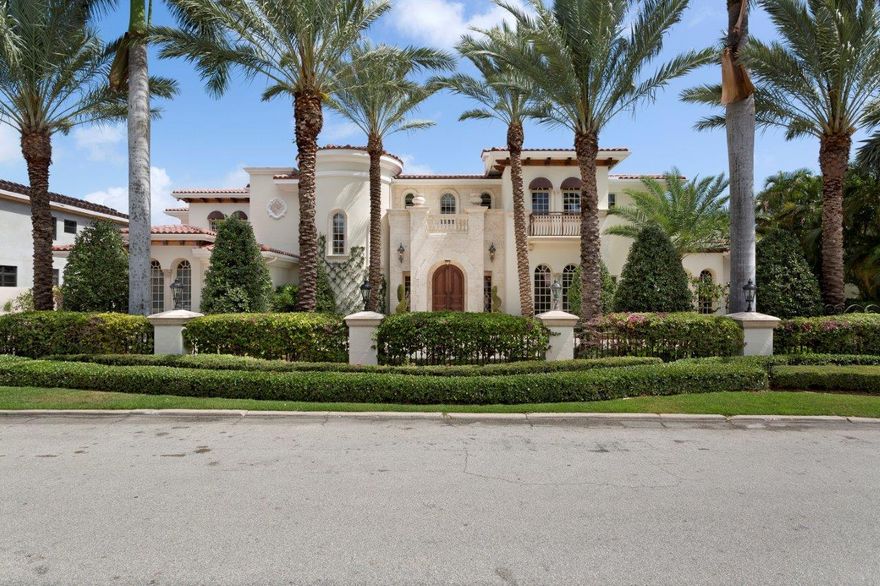 Expressing classic grace and grandeur, this stunning estate stands impressively on sprawling grounds fronting 150+/- feet on the Butterfly Palm Waterway of prestigious Royal Palm Yacht & Country Club. Breathtakingly beautiful with its rotunda-style staircase, the grand foyer is a prelude to the exquisitely appointed main living areas. Just outside these waterside rooms, the outdoor living space sets the stage for entertaining on the lavish pool terrace and loggia where guests can socialize, relax, and dine by the romantic open-air fireplace and trickling tiered fountain. Family and guests have exceptional privacy in the seven bedroom suites arranged in various wings on both levels, featuring the sumptuous multi-room master wing plus a separate guest retreat.