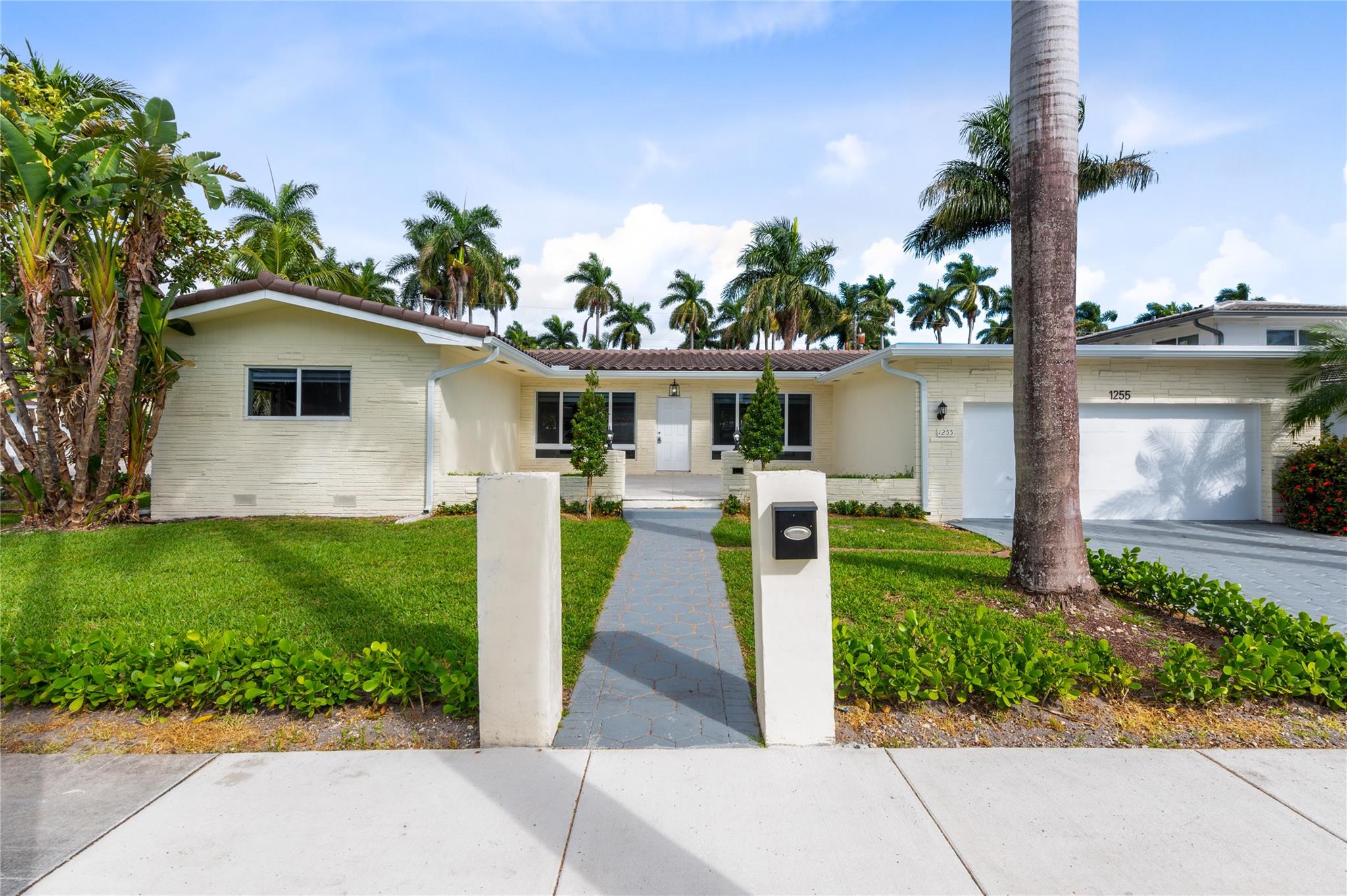 This Hollywood Lakes Gem Features A New Tile Roof! The Property Features A Total Of 4 Bedrooms, 3 Bathrooms, Two Car Garage, Pool And Fenced In Back Yard! Open Kitchen With White Cabinets And Appliances, Pantry & Countertop Bar. Spacious Primary Bedroom Features Sliding Glass Doors To Pool & Patio. Impact Windows (not Throughout). Wood Flooring Throughout! Freshly Painted! Walk In Closets! Laundry Room! Spacious Outdoor Living Area With Pool And Wood Fence, Fabulous For Entertaining! The Main House Features 3 Bedrooms & 2 Bathrooms With Additional 4th Bedroom & Bathroom Connected To House Through Entrance Located Off Covered Pool Patio. AC 2024. Water Heater 2020 - 40 Gal. Amazing Location Historic District Of Hollywood, Walk to Beach, Young Circle & Downtown Hollywood. Virtual Staging.