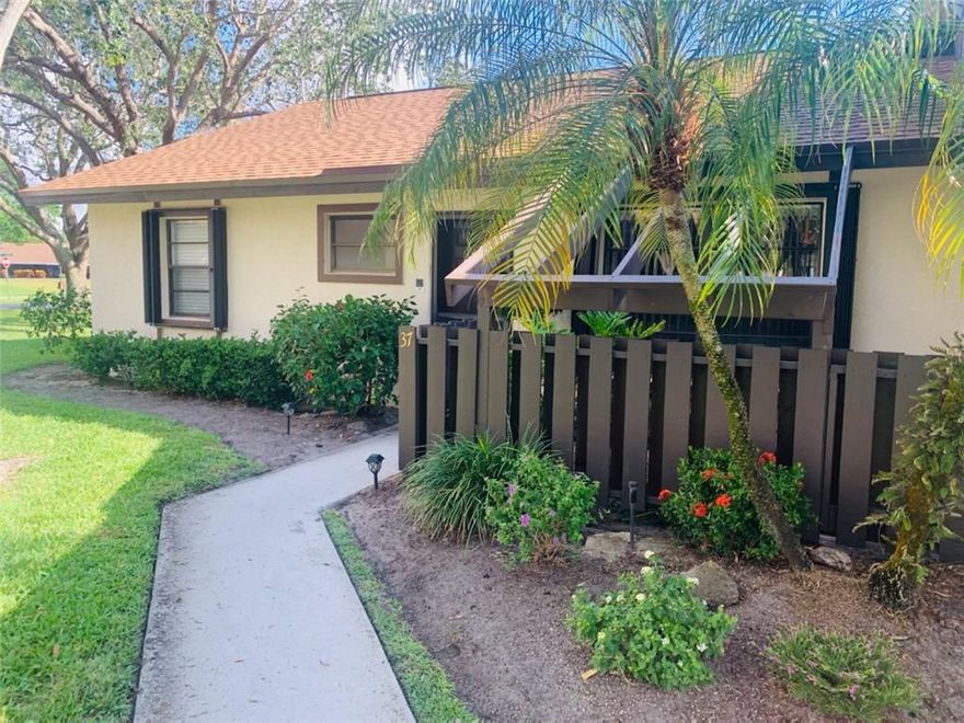 Welcome to this bright and inviting 2/2 end unit villa set in one of the most desirable locations in the Tradewinds community. Complete with an extended screened (tiled) patio perfect for entertaining or just relaxing while enjoying the serenity of lush greenery and picture-perfect partial lake view.  Steps to community pool, barbeque area, tennis court and clubhouse.  New A/C unit installed 2020, new roof in 2021, accordion hurricane shutters.  Prime Boynton Beach location close to I95, beaches, restaurants, shopping and PBI Airport. Amenities include Clubhouse, community pool, tennis court. Fiberoptic tv and internet included in maintenance. 1 pet not to exceed 25 lbs. allowed.  Must see this move-in ready villa!!