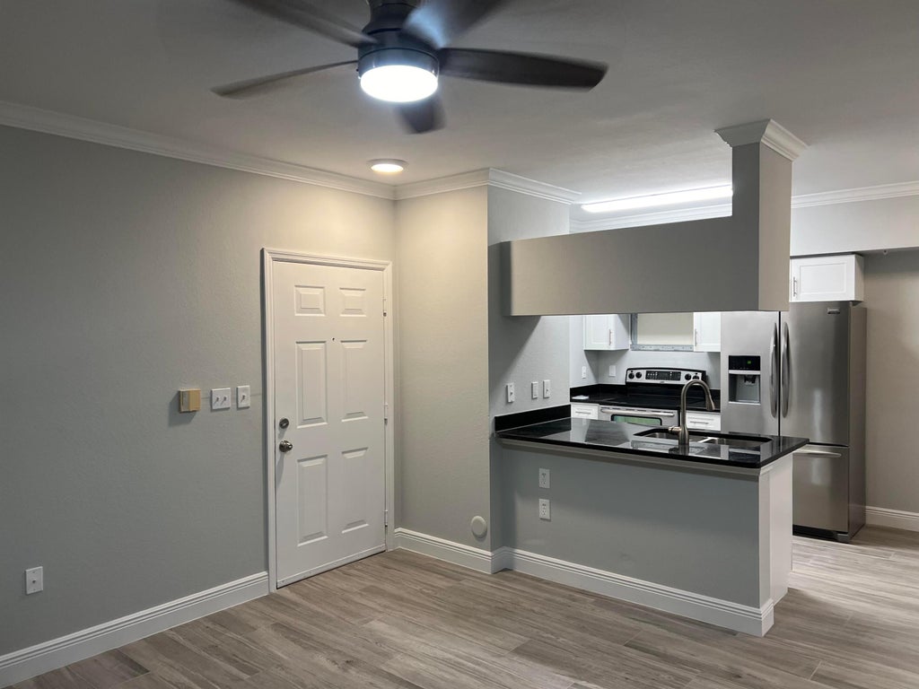 Photo of 6559 Emerald Dunes 102 Drive #102, West Palm Beach, FL 33411 (MLS # R11035663)
