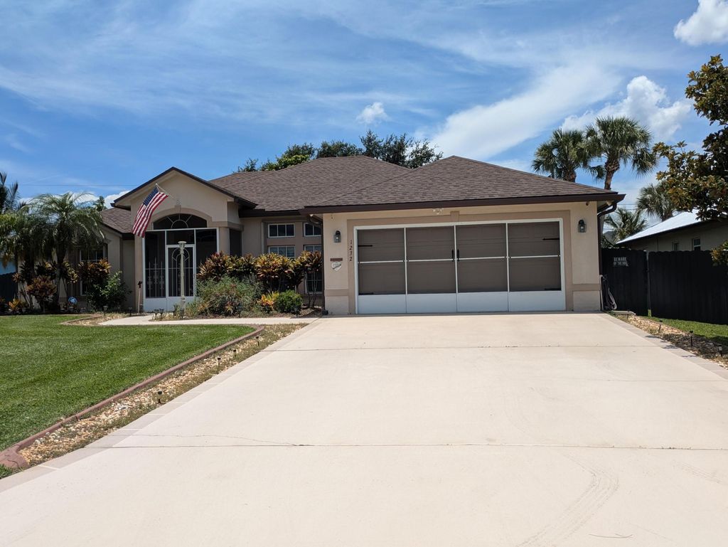Photo of 1232 SW Lawndale Avenue, Port Saint Lucie, FL 34953 (MLS # R11107102)