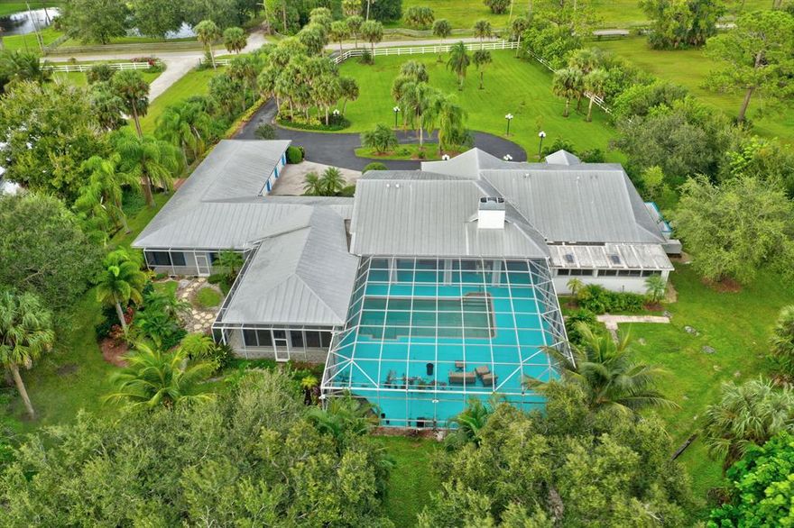 5 acres surround this Amazing Famliy Compound. Great Entertaining/Family Home with Screened Pool, Commercial Kitchen, 3 Car + RV Garage.  5 Bedrooms, 4.5 Bathrooms.  Please see all photos and Video to see the Extensive Amenities including a Screened Pool, Private wine room, Game Room, Ballroom, Metal Roof, Pond, Putting Green, Propane Tanks & Generator.  TOP RATED SCHOOLS, FENCED 5 ACRES OF LAND, Perfect for a Horse Lover.  Enjoy the County Lifestyle with City Restaurants and Shopping minutes away from your Ranch.  Come and personalize this home with Easy updates to Carpet and Paint.