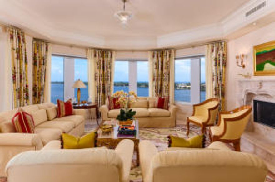 Sweeping Intracoastal and ocean views from this 4BR/4.5BA condominium. Full service building with exercise room, full time manager, club room, pool, and spa. Waterfront unit features marble flooring, fireplace, eat-in kitchen, four balconies, and library. Poolside cabana included.