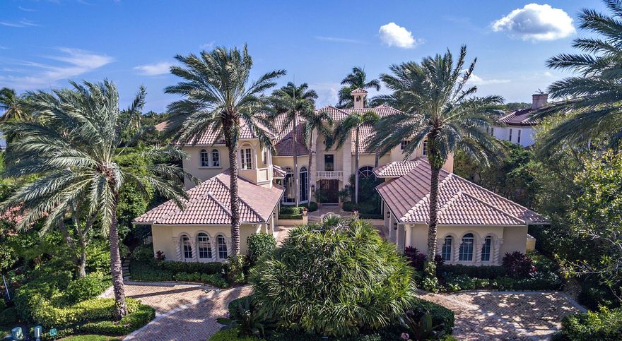 DRASTICALLY REDUCED BY $1.5 MILLION.BEST DEAL IN ADMIRALS COVE!10 Bedroom, 8 full & 2 half bath custom estate with exquisite details throughout. This 10,000 square foot estate has soaring 15' to 24' ceilings in the living areas, marble and wood floors, antiqued mirror panels in foyer and dining room, crown molding and hand painted wall finishes. Mexican shell stone columns & trim inside and out. The formal living room has a stone fireplace, walnut floor and tiled bar with sink, refrigerator and ice maker. Dining Room has 15' corbelled celling and stone crafter columns. Gourmet kitchen has all of the bells and whistles including an oversized island, SubZero refrigerator, Thermador 6 burner range with grill and 2 Bosch dishwashers. Custom built-ins in library and office.