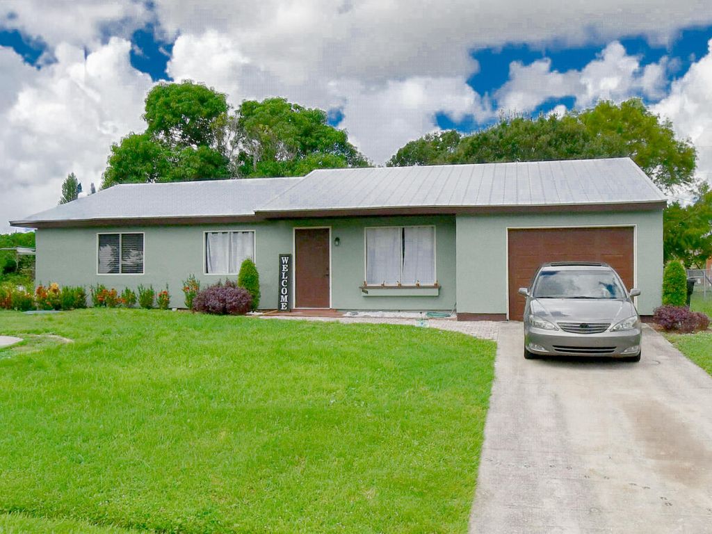 Photo of 2252 SE Aneci Street, Port Saint Lucie, FL 34953 (MLS # R11128392)