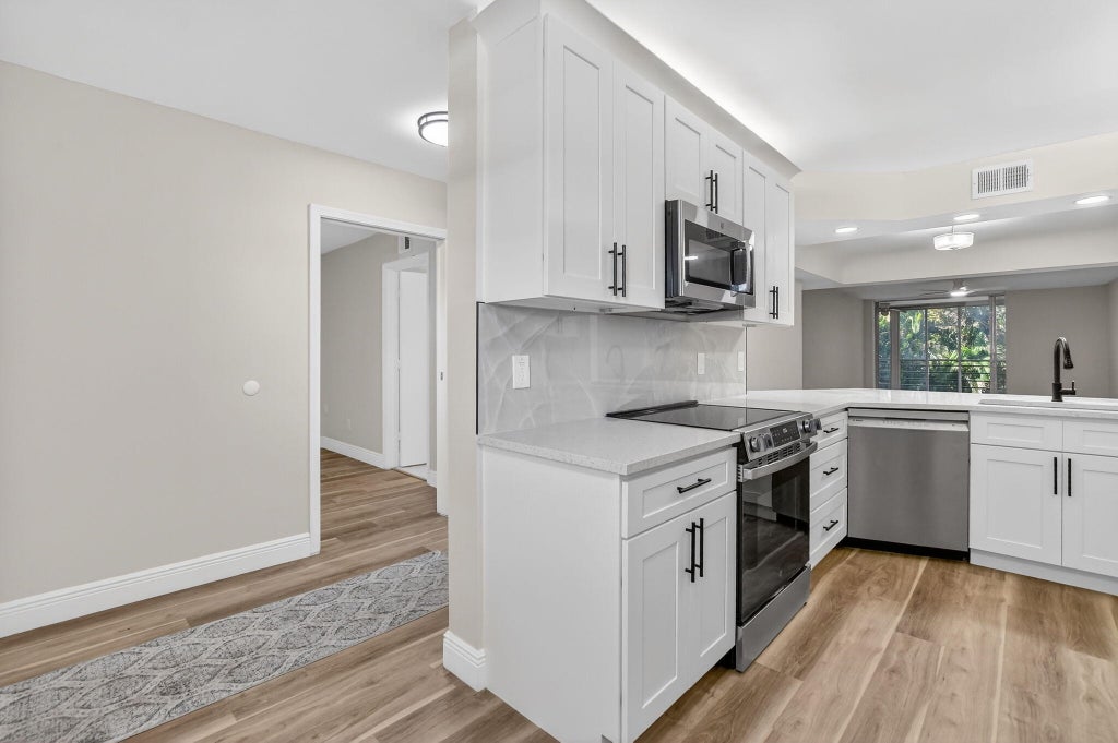 Photo of 23247 BARWOOD Lane N #205, Boca Raton, FL 33428 (MLS # B26077997)