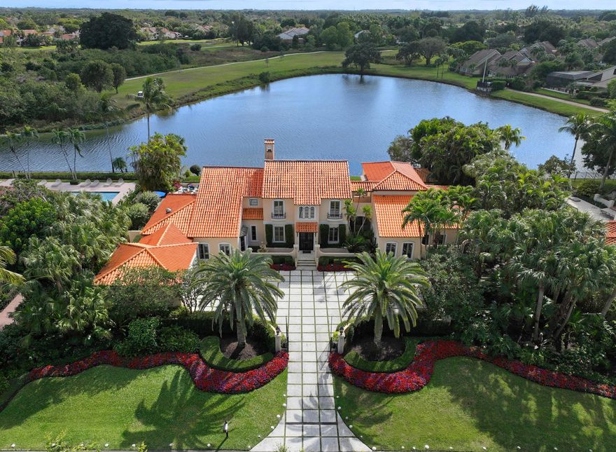 One of the best view in all of Palm Beach Polo. Palm Beach Polo. Located in sought after Maidstone Estates, this elegant 4-bedroom, 5 1/2-bath Mizner-inspired Mediterranean estate offers 6,000 square feet of refined living space. Designed for both comfort and sophistication, with spacious living areas both inside and out. Enjoy breathtaking long water views from the expansive lap pool, which overlooks a serene preserve. The private outdoor patio is an entertainer's dream, featuring a covered grill and bar area with a full cabana bath, as well as a firepit and outdoor entertainment bar, all with sweeping views of both the water and preserve. A separate guest suite with a private entrance provides ultimate privacy, while the home is equipped with impact glass for added security.