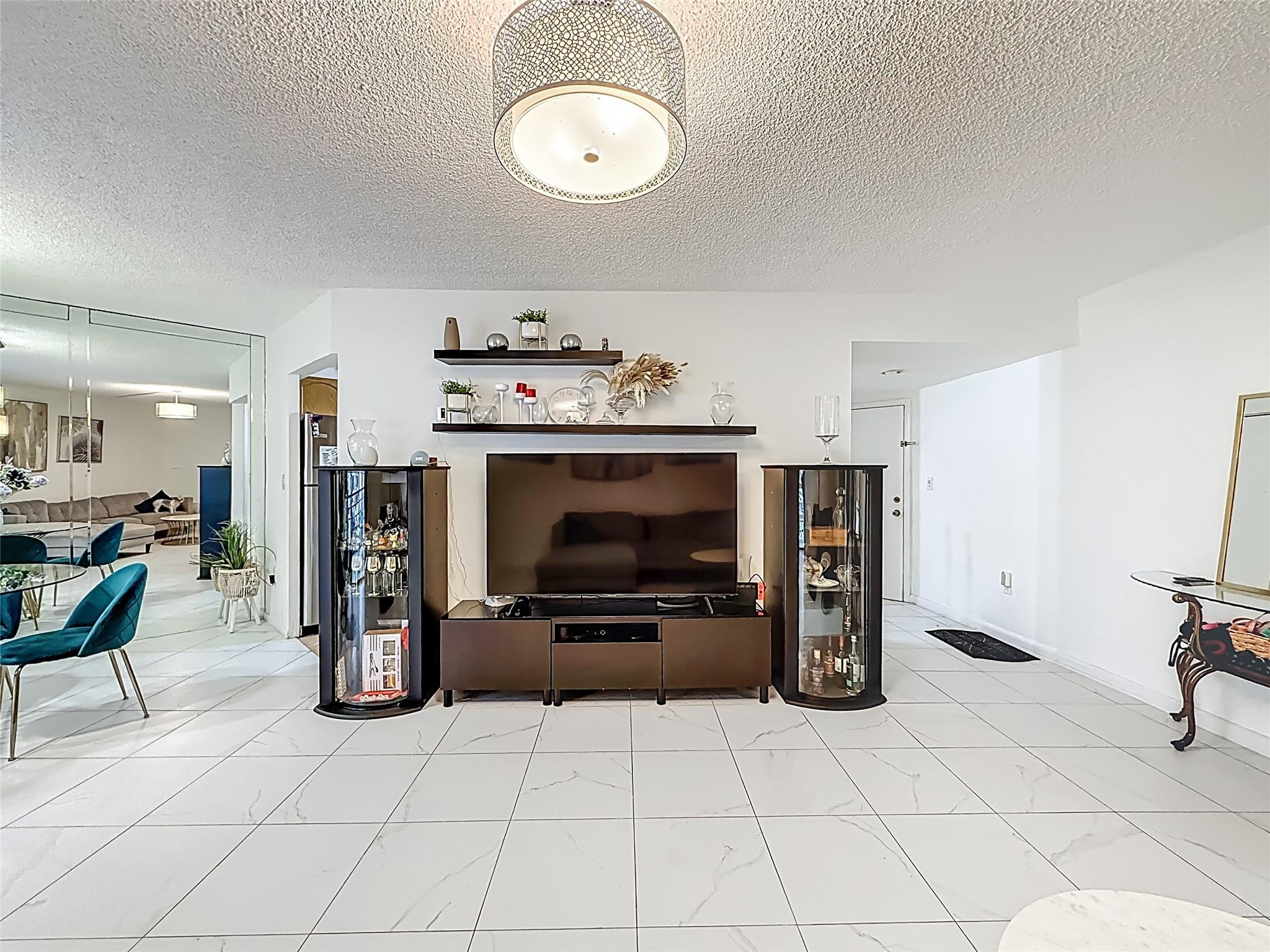 Spacious and well-maintained 2-bedroom, 2-bathroom condo located in a desirable Plantation Club community. This condo features a traditional layout with clearly defined living and dining areas, access to a screened-in patio thus offering a quiet and private space to relax and unwind.
*Interior Features: Primary bedroom with en-suite bathroom and walk-in closet. Generously sized second bedroom with ample storage. Modern bathrooms. Stackable washer and dryer in-unit for convenience. AC-2020; WH-2008
*Community Amenities: Secured entry and elevator access. Pool, hot tub, sauna, fitness center, clubhouse, and game room. HOA includes: Water, trash, insurance, exterior maintenance, and landscaping. No rentals permitted thus ensuring a quiet, residential environment.