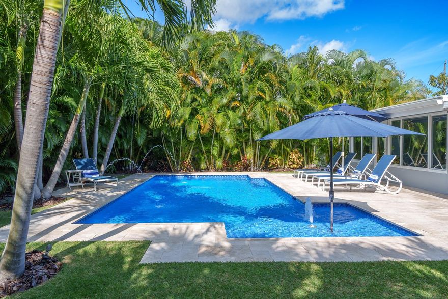 East Wilton Manors 3-bedroom/2-bath Heated salt water pool home with hot tub & covered patio. This upscale  home features a deluxe kitchen, open living spaces, and spacious rooms. The 3rd bedroom can easily be Office/Den/Family. All impact windows and doors. This home is your dream destination. Tropical Landscaping. Minutes from the beach, shops, and excellent dining. 3-bedroom/2-bath pool home with hot tub & covered patio in coveted Wilton Manors. This upscale ultra-modern home features a deluxe kitchen, open living spaces, and spacious rooms. The 3rd bedroom can easily be Office/Den/Family. This home is your dream destination. Relax outside in the shade or sun surrounded by the heated saltwater pool and enjoy your own tranquil backyard. Minutes from the beach, shops, and excellent dining.