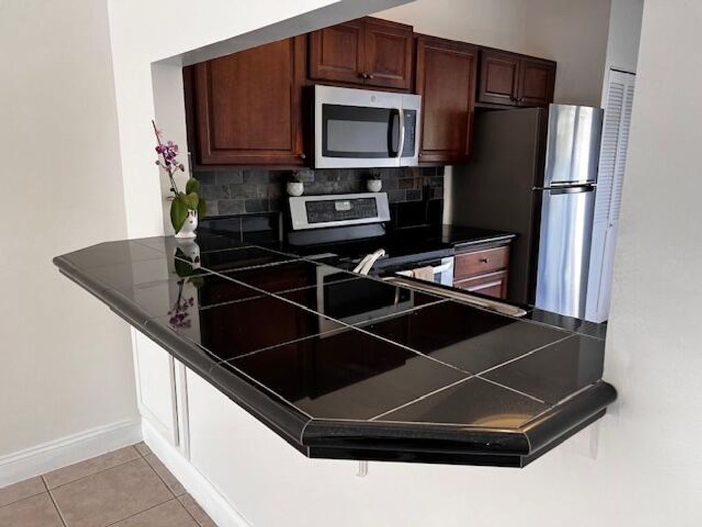 Photo of 10323 Boca Bend #K4, Boca Raton, FL 33428 (MLS # R11154473)