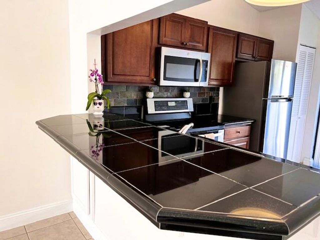 Photo of 10323 Boca Bend #K4, Boca Raton, FL 33428 (MLS # R11154473)