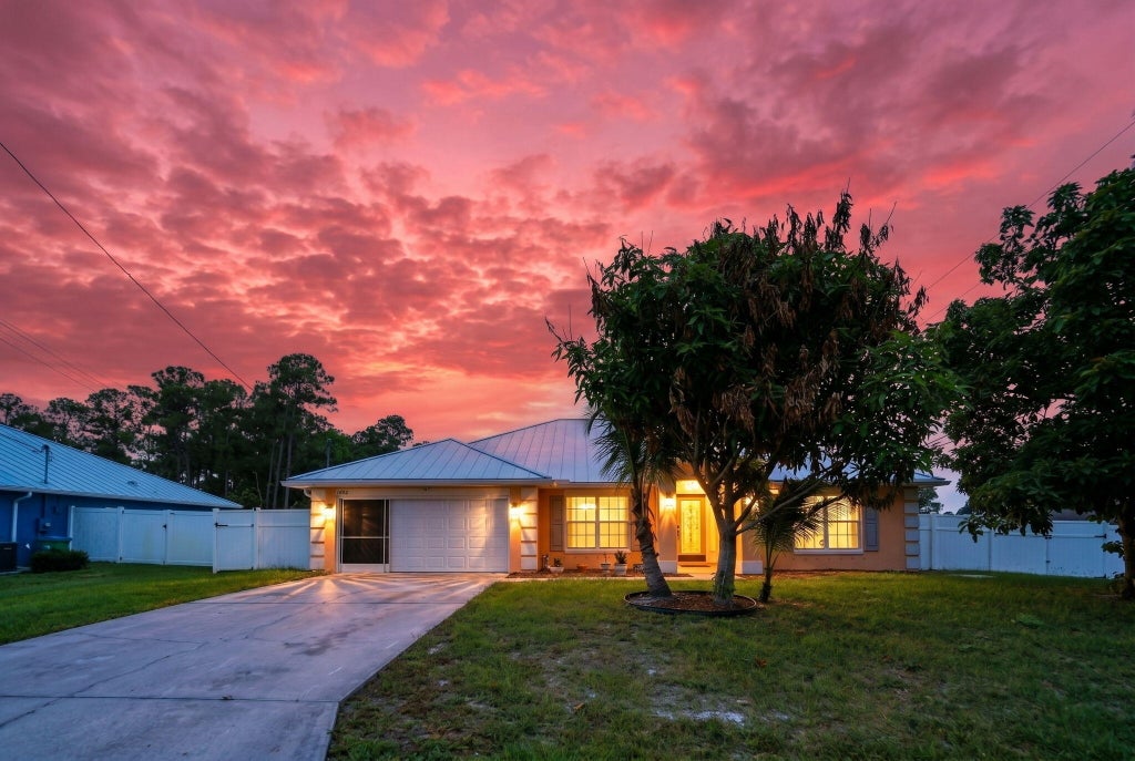 Photo of 1692 SW Lofgren Avenue, Port Saint Lucie, FL 34953 (MLS # B26039913)