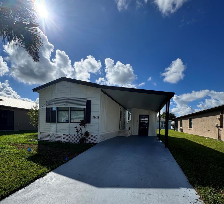 Lovely 2-bedroom 2-bath home in the 55+ Spanish Lakes Fairways community. This home features an open eat-in kitchen with newer appliances and a bar that provides extra seating. The home features a split floor plan for added privacy when entertaining guests. A peaceful screened-in patio is excellent for morning coffee or evening cocktails. Tranquil street. New standing seam metal roof (2024), Vapor barrier (2024). Laminate flooring throughout, no carpet.  Bathrooms feature new fiberglass showers, ceiling fans, ceiling vents, and seals. The exterior and Interior are newly painted. Home is being sold unfurnished.  Lawn care, trash removal, and golf are included in the lot rent. The community features two pools, tennis, pickleball, bocce ball, shuffleboard, and many other amenities.