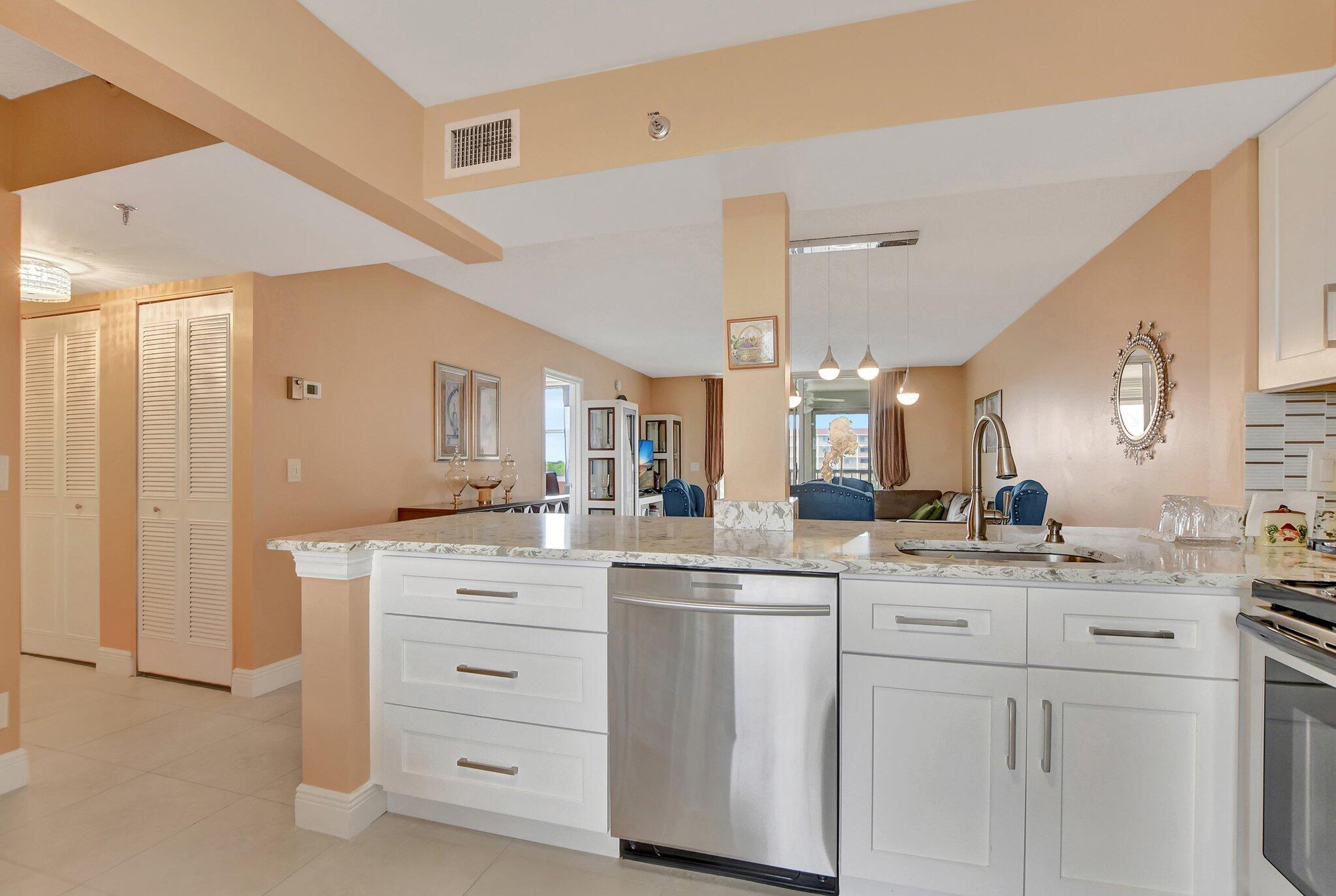 Enjoy stunning panoramic views from this beautifully renovated 2-bedroom, 2-bath condo located on the 6th floor with elevator access in the desirable Bonaire at Villages of Oriole 55+ community. This light-filled home features a brand-new kitchen with a breakfast bar that opens to a spacious living area, ideal for entertaining. Elegant porcelain tile flooring flows throughout, complemented by impact glass windows and a convenient stacked washer and dryer. Step out onto the charming balcony to relax while taking in serene water views and the community's landscaped walking and jogging trails.Residents will enjoy an active 55+ lifestyle with access to a clubhouse, fitness center, party room, billiards, shuffleboard, and more.