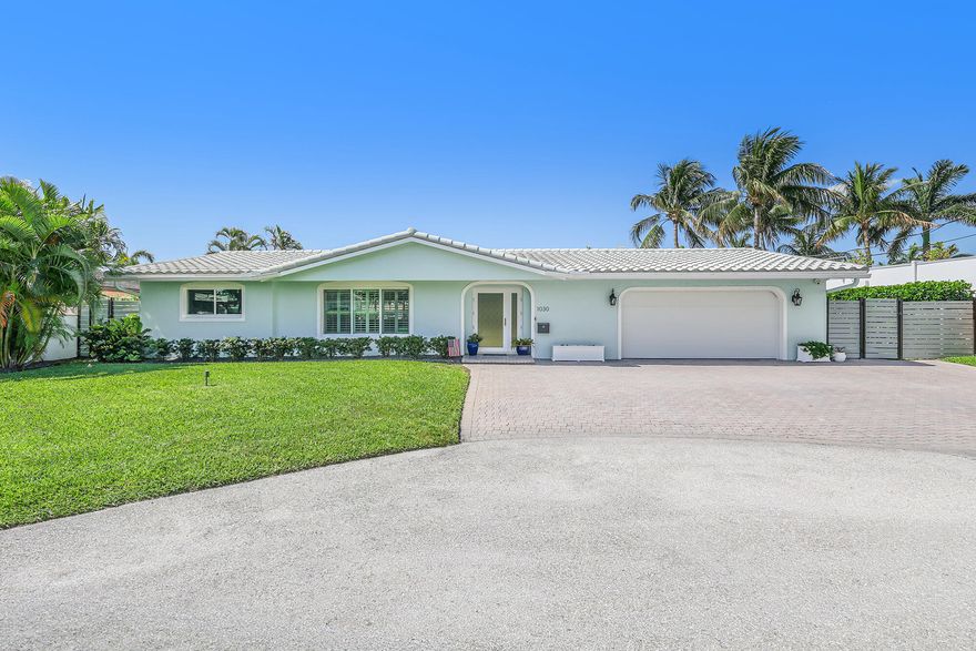 Waterfront Luxury in Exclusive Harbor Village Island - No Fixed Bridges, No HOA. Wake up to wide-water views and effortless ocean access in this impeccably renovated waterfront residence, ideally situated on a quiet cul-de-sac within the prestigious Harbor Village Island community; one of Pompano Beach's most desirable boating enclaves known for its prime Intracoastal proximity and coastal lifestyle. Offering 95 feet of deepwater frontage on an approximately 100-foot-wide canal, this 4-bedroom, 3- bathroom pool home delivers a rare combination of location, design, and function, with no fixed bridges and direct ocean access in approximately 10 minutes via Hillsboro Inlet—a true boater's paradise. Completely redesigned with a modern aesthetic, the home features a bright open-concept floor plan enriched by wall-to-wall Italian porcelain plank flooring and abundant natural light. The designer kitchen serves as the centerpiece of the home, outfitted with shaker cabinetry, Cambria quartz countertops, and updated appliances, seamlessly connecting to spacious living and dining areas designed for both entertaining and everyday comfort. The residence offers 4 well-appointed bedrooms and 3 fully remodeled bathrooms, along with an indoor laundry room under air and new washer and dryer. Additional upgrades include PGT hurricane-impact windows and SIW hurricane-impact doors, a brand-new HVAC system, and a new garage door, ensuring true move-in-ready convenience. Outdoor living is elevated with a beautiful pool area and travertine deck, creating a private setting ideal for relaxing or hosting along the water. For boating enthusiasts, the property stands out with a 2020 seawall and 85-foot composite dock, complete with dual shore power towers, a 15,000 lb boat lift, integrated lighting, and a dedicated boat loading platform. The yard has been professionally leveled to match the new seawall elevation, enhancing both usability and visual appeal. Ideally located just minutes from pristine beaches, dining, and entertainment, and approximately 30 minutes to Fort Lauderdale-Hollywood International Airport, this residence offers the perfect blend of luxury, convenience, and South Florida waterfront living. Key Features: 95' waterfront | 85' dock | ±100' wide canal | No fixed bridges | Ocean access in ~10 minutes | Gated Island community | Cul-de-sac setting | No HOA | 4BR / 3BA/2 Car garage| Fully renovated with high-end finishes | 2020 seawall + composite dock + 15,000 lb lift | Impact windows/doors | Newly Installed AC | Turnkey condition