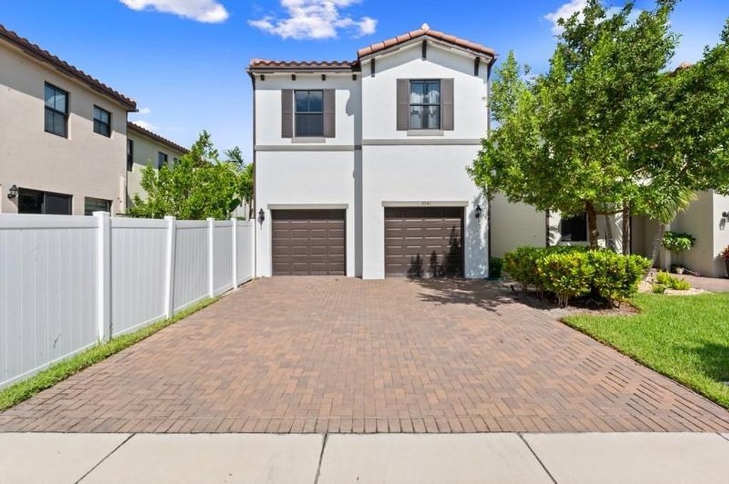 Photo of 5041 Laurel Oak Drive, Riviera Beach, FL 33410 (MLS # R10729847)