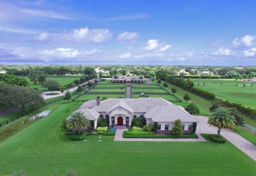Prime Location in the front part of Palm Beach Point. 5.68 Acres on the cul de sac & with direct bridle path access to Pierson Road, WEF & Grand Prix Village. Center-aisle stable with 8 stalls & 2 wash stalls, plus a 1Br/1Bth staff apartment. Large riding arena, 7 grass paddocks and separate barn entrance. The 4Br/4Bth main residence has a heated pool, marble & wood floors, along with granite finishes.  The kitchen boasts an eat-in ctr.-island, professional grade gas range, copper country-style sink & huge walk-in pantry.  The spacious Master suite offers views to the stable and a sitting room/office, an oversized walk-in closet and Jacuzzi tub. Poolside there is a covered patio with summer kitchen and fenced green areas for family pets. Please see the ''Supplement'' for more details. The Main Residence:
Marble & Wood Floors
Plantation shutters
Impact windows & doors
Mahogany wood front doors
Master Bedroom with French doors & views to the stable.
Master bathroom with whirlpool tub, dual vanities & bidget
Sound systems in the family room, master & patio
Formal Dining room with serving counter with wine chiller
Central Vacuum throughout
Mudroom entry from garage

Reverse osmosis water treatment system supports the house and stable.
Electric pool heater.
Laundry machines are Electrolux (house & stable)

Barn & Apartment::
Marble floors, walk-in closet
Kitchen with dishwasher & refrigerator
Alarm system
Fly spray system
Water to each stall
French Doors to the patio
Air-conditioned tack room.
Stall cameras & sound system
Separate satellite at the barn
Attached storage garage

Separate gated barn drive entry.  Gate at the rear of the property to the bridle path.

Light fixtures in Dining room & Entry fixtures are excluded.

Generator wired to run: refrigerator, water, garage & AC.  Installed Sept. 2017.