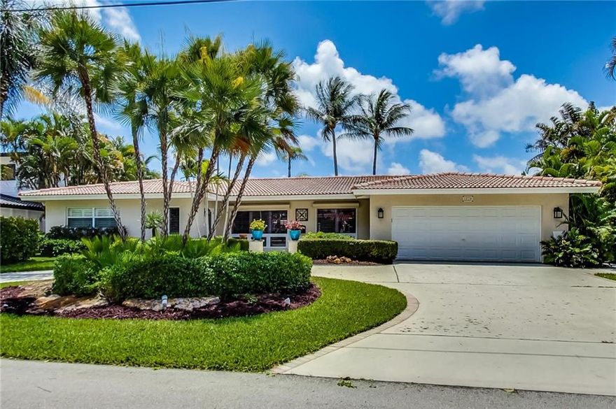 Beautifully remodeled resort style waterfront home checks all the boxes ! Turn key move right in ! 3 bedrooms, 3 bath with updated large master bath and rare large walk in closet with built-ins.  Marble travertine throughout meets the kitchen with water view.  Separate laundry room takes you to the full cabana bath and true two car garage.  Backyard boasts a fun tiki bar with TV next to saltwater pool with solar water heater.  Don't forget to check out the "widows walk" for elevated views and enjoying some alone time.  Dock in excellent condition with 30k lb boat lift.  Deep water canal takes you to ocean with no fixed bridges.  Specifications subject to buyer's verification at inspection.