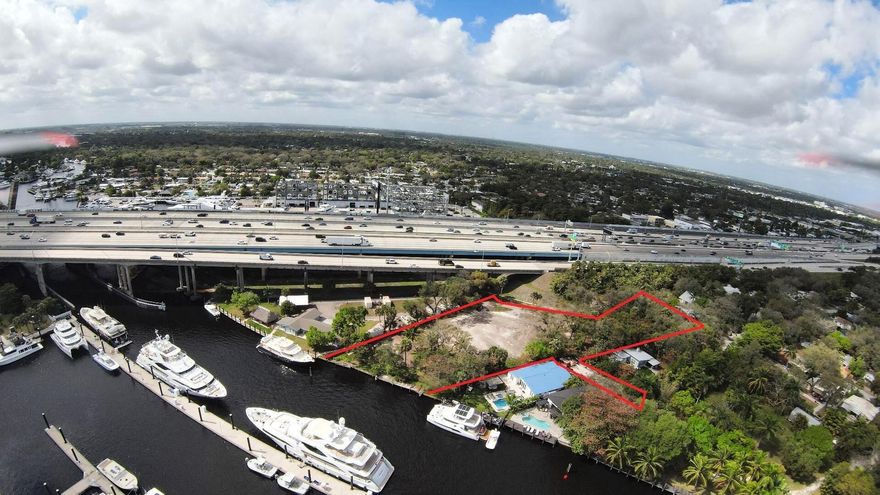 RARE WATERFRONT LOT FOR SALE - 37% INCREASE IN LOT SIZE SINCE LAST SOLD!!  Step into luxury waterfront living with this exceptional property offering 140 feet of private dock space, perfectly suited for your mega yacht. Located directly across from a marina, this rare parcel boasts deep water access with no fixed bridges, providing unparalleled convenience for boat enthusiasts to easily access the ocean, or enjoy the day on the boat.  Build your dream home or take advantage of the opportunity to develop several homes for income potential (zoned RS-8). Situated just minutes from the airport and major highways, this location combines tranquility with accessibility. Whether you're looking for a private estate or an investment opportunity, this property is a must-see.