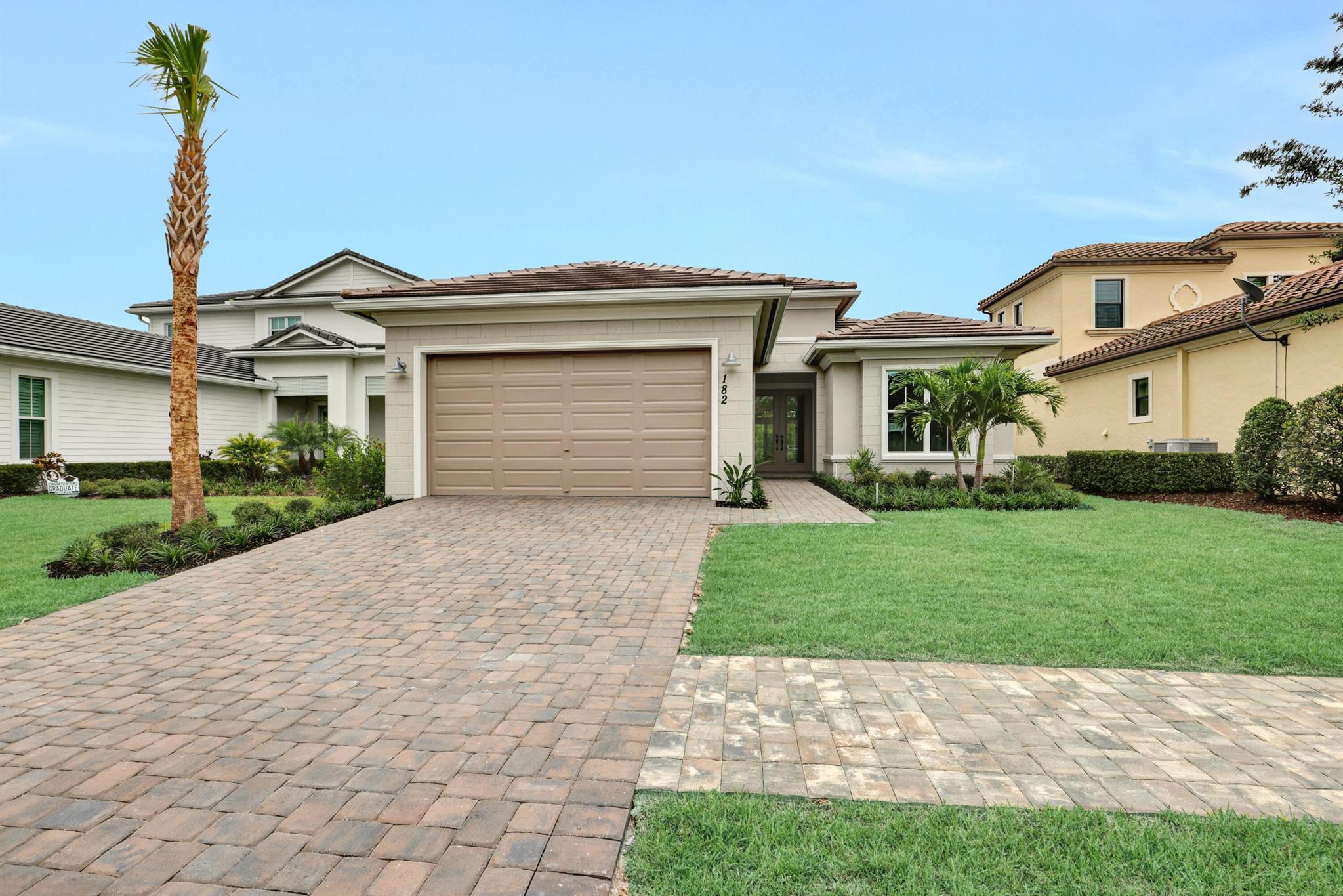 Nestled in the exclusive Tom Watson design golf course section of the sought-after Tesoro Club, this move-in ready 3-bedroom, 2.5-bath home blends elegance, comfort, and privacy. The expansive primary suite offers serene backyard views, while sophisticated tray ceilings enhance the open-concept design. A chef's dream, the gourmet kitchen boasts a 5-burner gas range, stainless steel appliances, and quartz countertops. Porcelain flooring flows throughout the main areas and primary bedroom, exuding modern refinement. Impact-rated windows and doors fill the home with natural light. The spacious backyard is perfect for outdoor living, and an 8' garage extension provides room for a golf cart. Experience luxury in Tesoro Club!