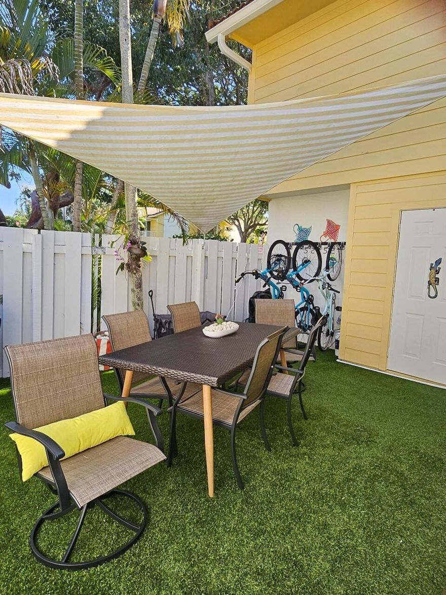 This spacious and beautifully furnished Townhome offers 2 bedrooms and 2.5 baths. The first level provides an open concept design with tile flooring throughout. South facing sliding glass doors opening to a super cute private courtyard with extended outdoor living space. Gorgeous updated kitchen, countertops, and navy stainless appliances; breakfast bar opens into the dining and living room area. Located upstairs is 1 bedroom with a full bath. The community has a direct and private pathway for walking or biking directly to the beach! And Carlin park is adjacent for all your other recreational needs including an exercise course, pickleball, tennis, volleyball, softball, picnic pavillions, bocce, saltwater fishing, playgrounds, an Amphitheater and cafe!
