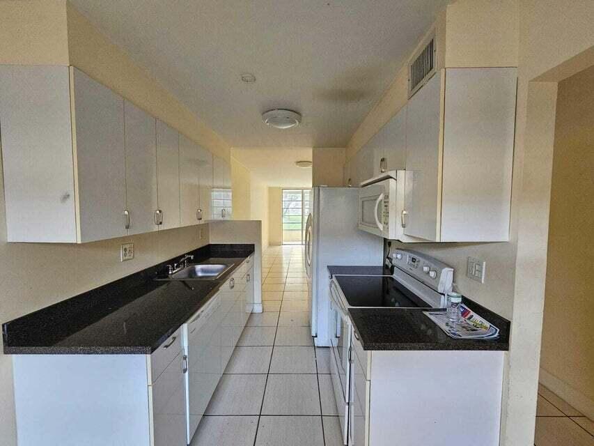Photo of 3099 NW 48TH Avenue #155, Lauderdale Lakes, FL 33313 (MLS # B26079430)