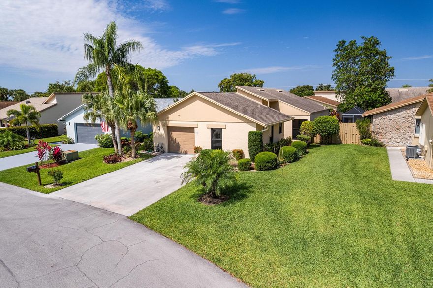 Welcome to this exquisitely remodeled DESIGNER move-in ready single family residence located in the heart of Delray Bch's highly coveted 55+ GATED community of Rainberry Bay.  Step inside experience a BRIGHT expansive living space enhanced by VAULTED ceilings RECESSED lighting and multiple SKYLIGHTS that bathe the home in natural light throughout the day. Thoughtfully designed split bedroom floor plan provides ideal privacy.  At the CENTER of the home is a CHEF'S kitchen worthy of a magazine spread fully transformed with soft-close cabinetry, granite countertops GE profile stainless steel appliances a wine cooler and generous storage. This kitchen delivers both beauty and function.  Both bathrooms offer a SPA-INSPIRED retreat, featuring ADA wide doorways, designer tile work and luxurious  INFINITY showers.  This home offers elegant 7" hardwood cork-backed flooring.  The PRIMARY suite includes custom-designer closets with a closet carousel feature maximizing organization and style. 2026 washer/dryer. This exceptional home blends modern sophistication with effortless comfort offering a lifestyle defined by elegance & convenience. This home is truly a designer masterpiece showcasing premium upgrades that elevate every detail.  Rainberry Bay boasts a well-equipped fitness center, clubhouse, card rooms, main heated pool, satellite pools, spa, theatre, walking paths, and lakes. For those who enjoy outdoor activities, pickleball, tennis, bocce & basketball courts and a playground for children are avail.  HOA includes: cable, internet, trash, lawn maintenance and as an added BONUS covers ROOF.  The community's prime location in Delray Beach also offers easy access to a wide range of shopping, dining, and entertainment options, as well as beautiful beaches and outdoor recreational areas.