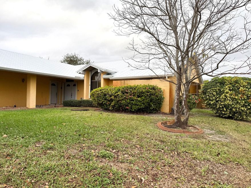 This unique property offers 4 bedrooms (one used as an office) in a split plan, with two bedrooms featuring private exterior access—ideal for an in-law setup or rental space. Enjoy two dining areas, a spacious living/family room, a large enclosed sunroom, and an in-ground pool. Built in 1988 and well loved, it’s ready for your updates and vision. Perfect for a growing family or an investment opportunity. The home has a well for irrigation and City water/sewer. Conveniently located minutes from shopping, restaurants, beaches, and Florida’s Turnpike. Don’t miss this opportunity.