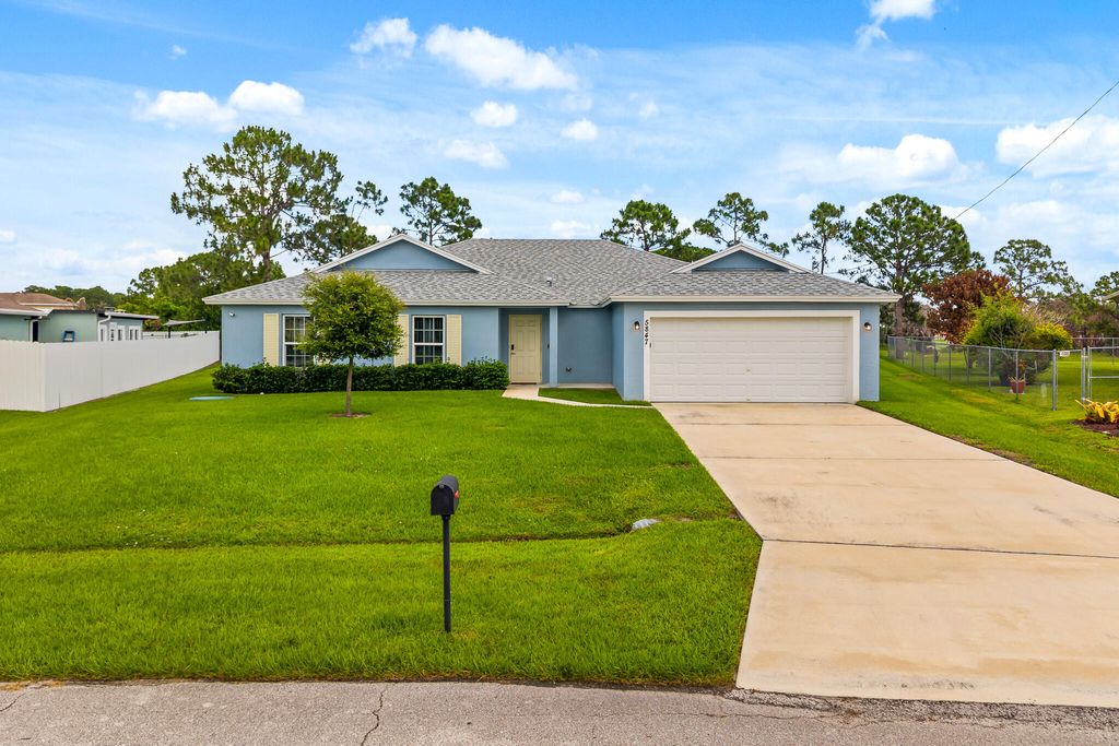 Photo of 5847 NW Gillespie Avenue, Port Saint Lucie, FL 34986 (MLS # B26031500)