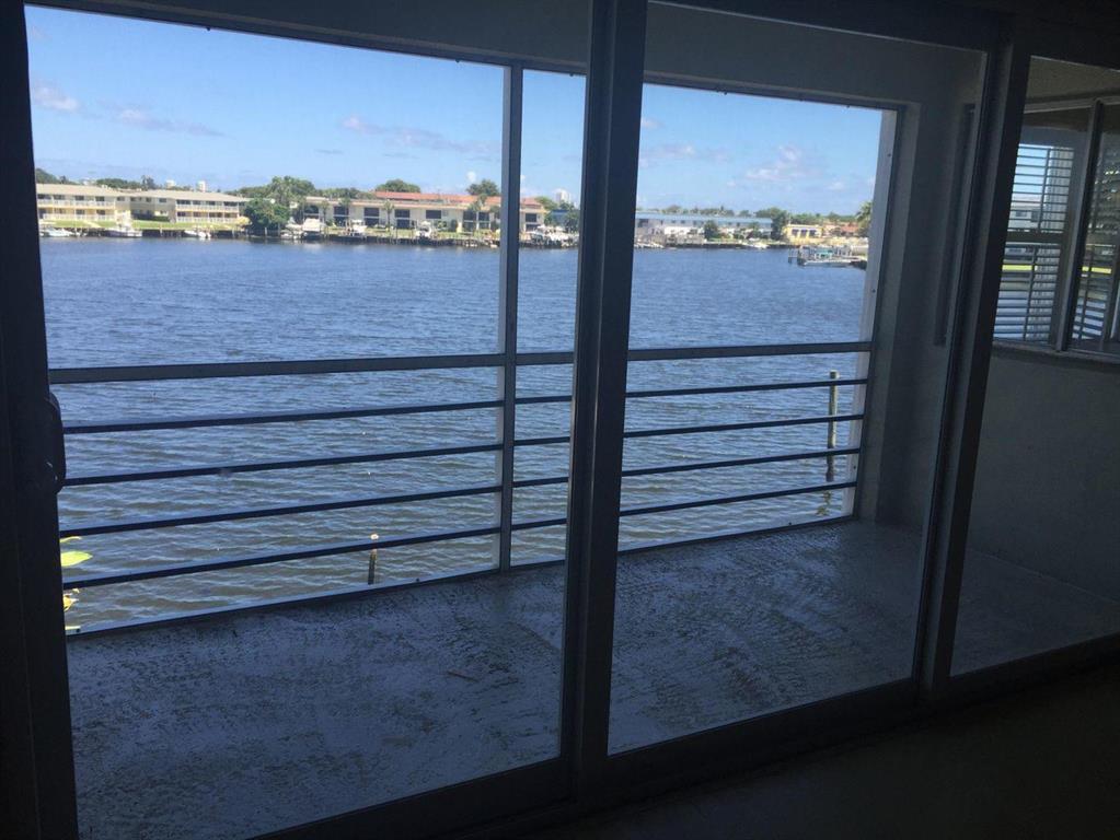 Enjoy water views of the Earman River from your living room in this charming 2/2 condo ! Located in desirable N. Palm Bch , Brand new AC installed, W/D located inside unit*Water Incl. *Quick Move In
