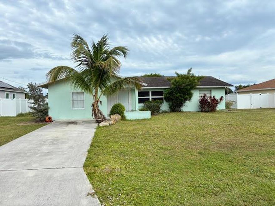 Discover a fantastic opportunity with this charming home in the heart of Port St. Lucie, just moments from the Turnpike. Perfect for first time buyer CBS home offers incredible potential. Featuring 2 bedrooms and 2 bathrooms, plus a versatile garage converted into a studio or bedroom, it provides flexible living options. Enjoy the spacious yard complete with a relaxing hot tub, ideal for entertaining or unwinding. Priced to reflect its current condition, this home is ready for your personal touch and vision.