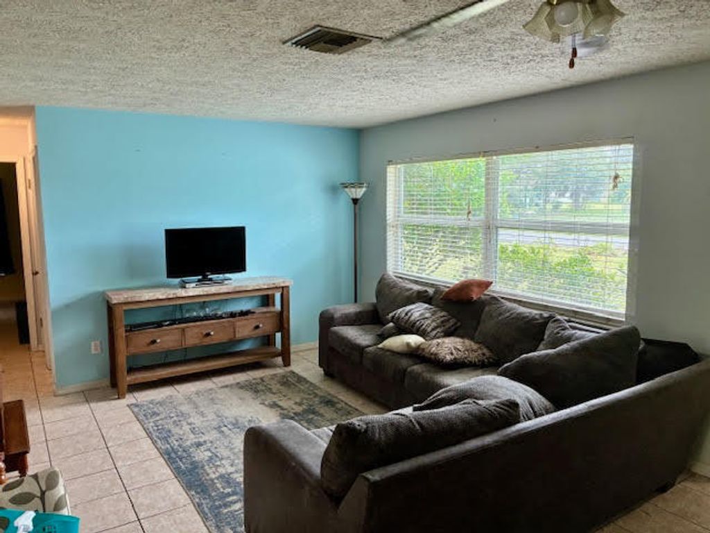Photo of 2351 SW Chestnut Lane, Port Saint Lucie, FL 34953 (MLS # R11138814)