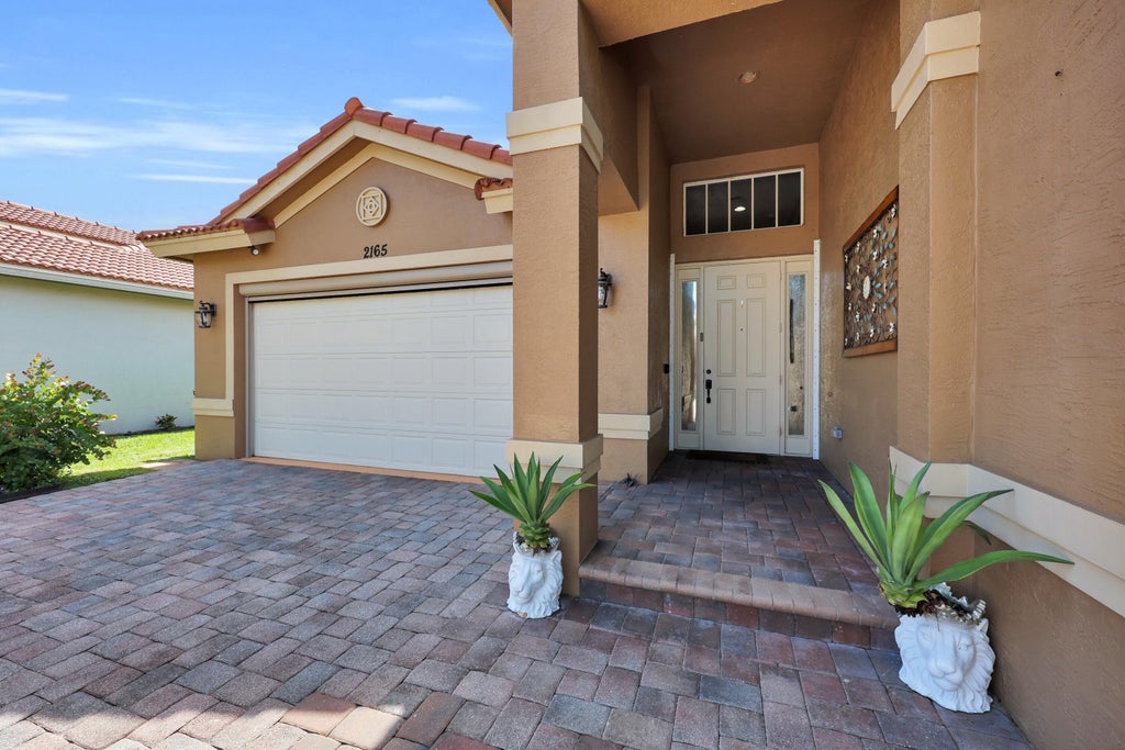 Photo of 2165 Newport Isles Boulevard, Port Saint Lucie, FL 34953 (MLS # B26091444)