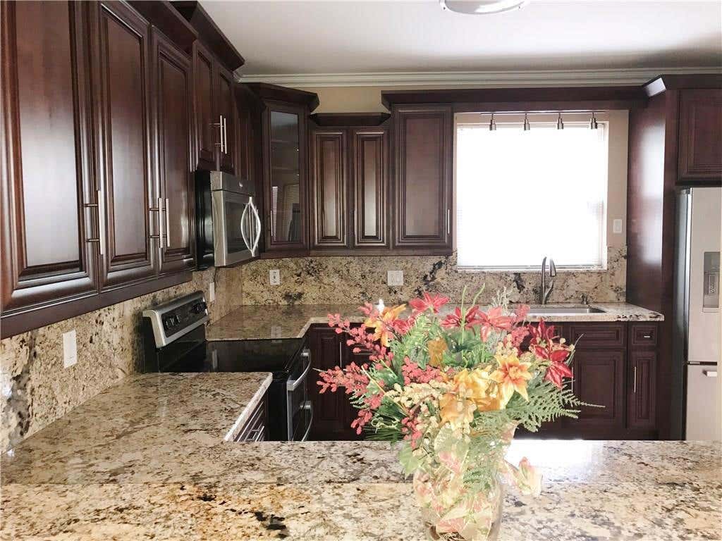 Photo of 1295 WEEPING WILLOW Way #1295, Hollywood, FL 33019 (MLS # B26060798)