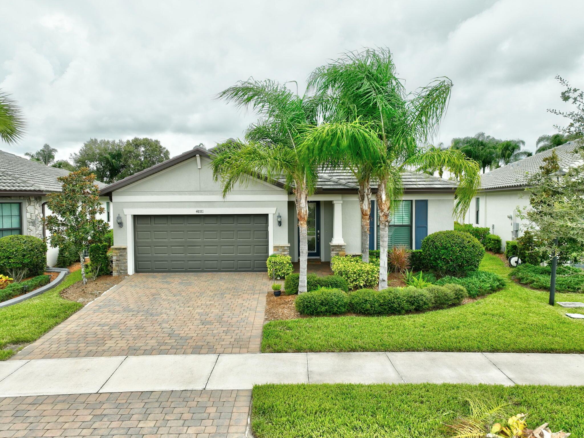 Prepare to be impressed when you enter this former model home in the all ages, gated community of WATERWAY VILLAGE in Vero Beach. Well appointed with over 2100 sq ft under air, expertly styled by interior designers, offers luxury living with an open layout, gourmet quartz kitchen, designer fixtures, Extended paver screened lanai, luxury vinyl floor, crown molding, impact glass, A private back yard, beautiful owners bedroom with spa-like en-suite bathroom. The guest bedrooms and separate den are very spacious. The large laundry room has additional storage. This has it all with the amenities Lakes of Waterway Village has to offer...Pickle Ball, Tennis, Bocce, Resort style pool and Hot Tub, Fitness Center, Club House, and pool terrace.