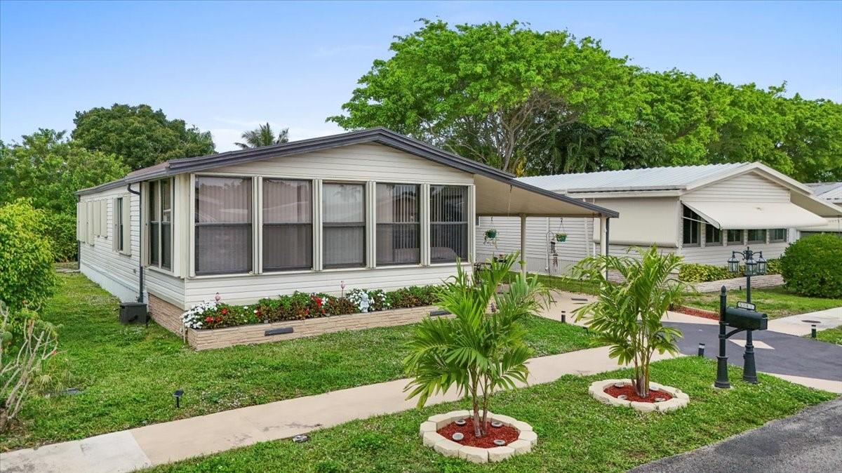 SEASONAL RENTAL - MANUFACTURED HOME LOCATED IN A GATED, 55+ COMMUNITY WHICH INCLUDES USE OF THE CLUBHOUSE, HEATED POOL, TENNIS, PICKLEBALL AND MORE. THIS IS A 2 BEDROOM, 2 BATH HOME WITH THE FRONT ENCLOSED PATIO FURNISHED AS A 3RD BEDROOM. THERE IS ALSO AN OPEN PATIO AREA UNDER THE CARPORT. 3 MONTH MINIMUM RENTAL PERIOD, PROPERTY IS ALSO FOR SALE