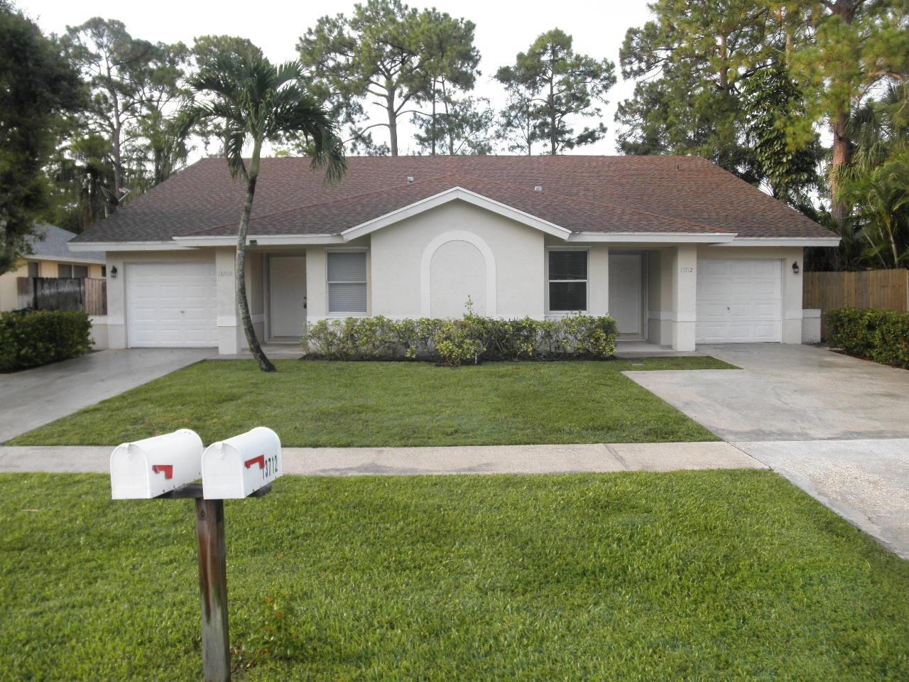 Spacious 3/2/1 Duplex in the Village of Wellington where you are close to the shops and restaurants. This property features split bedrooms, all tile flooring & fresh paint throughout, vaulted ceilings, an eat-in-kitchen plus a pantry, master bedroom has a large walk-in closet, a screened in patio area and a fenced in backyard with Lawn Service included in the rent! FIRST & SECURITY MOVE IN!