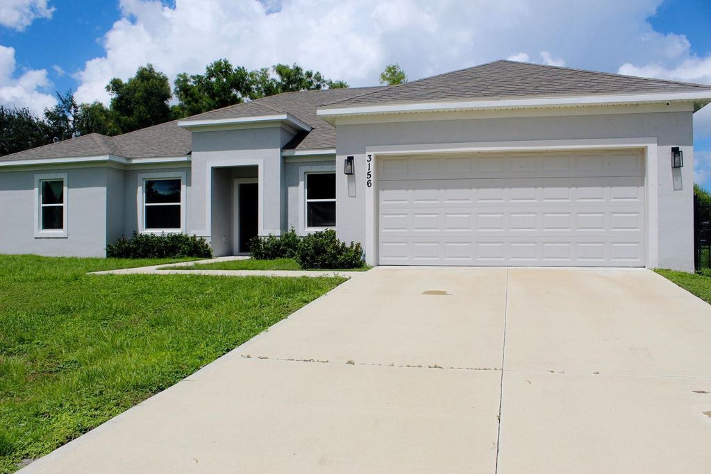 Photo of 3156 SW Ann Arbor Road, Port Saint Lucie, FL 34953 (MLS # R11020862)