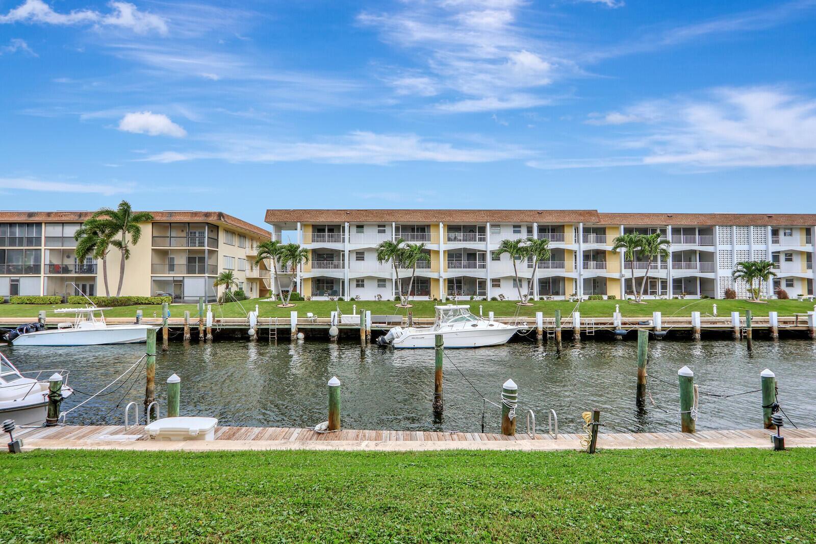 ** 55+ age restricted waterfront community. Available for unfurnished Annual Lease only. No pets. ** Renovated, ground floor, 1br 1 ba, located in a sought-after intracoastal community. Redesigned kitchen to create an open floorplan, perfect for entertaining. Updates include cabinetry, granite countertops, stainless steel appliances, breakfast bar, tile flooring, bathroom vanity, toilet, ceiling fans & lighting. New A/C. Spacious bedroom with private screened patio overlooking the canal & boats. Accordion hurricane shutters for peace of mind during storms. Impact glass front door with built-in blinds. Premium location in the building, with a covered entry that keeps the front door out of the elements and provides privacy from the parking lot. Prime parking space in front of the unit.
