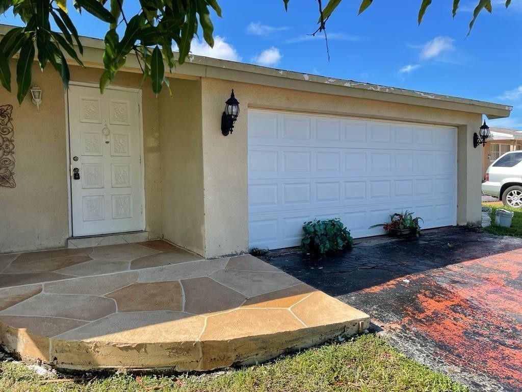 Photo of 11700 NW 29th Place, Sunrise, FL 33323 (MLS # F10534088)