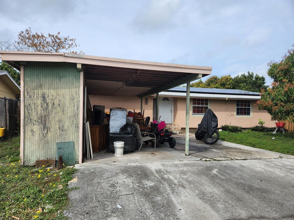 Photo of 3823 Chickasha Road Rd, Lake Worth Beach, FL 33462 (MLS # R10788923)