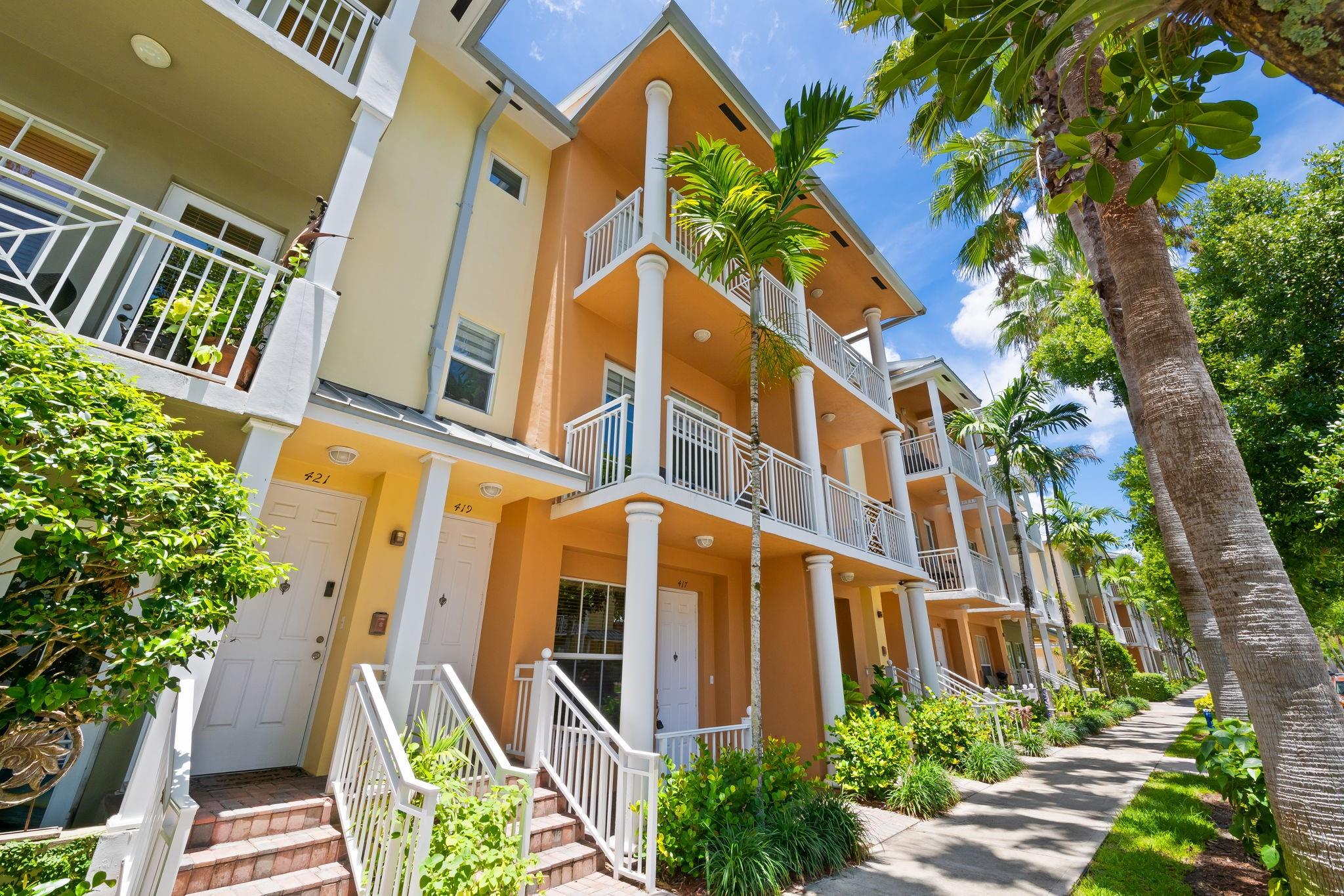 Welcome to modern elegance at 419 Olssen Avenue in Fort Lauderdale's Village of Sailboat Bend. This inviting 2-bedroom, 2.5-bath townhome spans 1,679 square feet of pure delight. Enjoy recently upgraded spaces with fresh paint, chic light fixtures, and a newer A/C and water heater. The revamped kitchen features stylish blue and white cabinets with quartz countertops, while the primary bathroom is fully remodeled.
With sophistication throughout, from hardwood and tile floors to modern lighting, the home boasts high ceilings and recessed lighting. Savor the luxury of a double sink bathroom, spacious walk-in closet, and laundry room with a newer washer/dryer. The home includes TVs, featuring a 75-inch in the primary bedroom and a 65-inch in the guest room. Welcome to Fort Lauderdale!