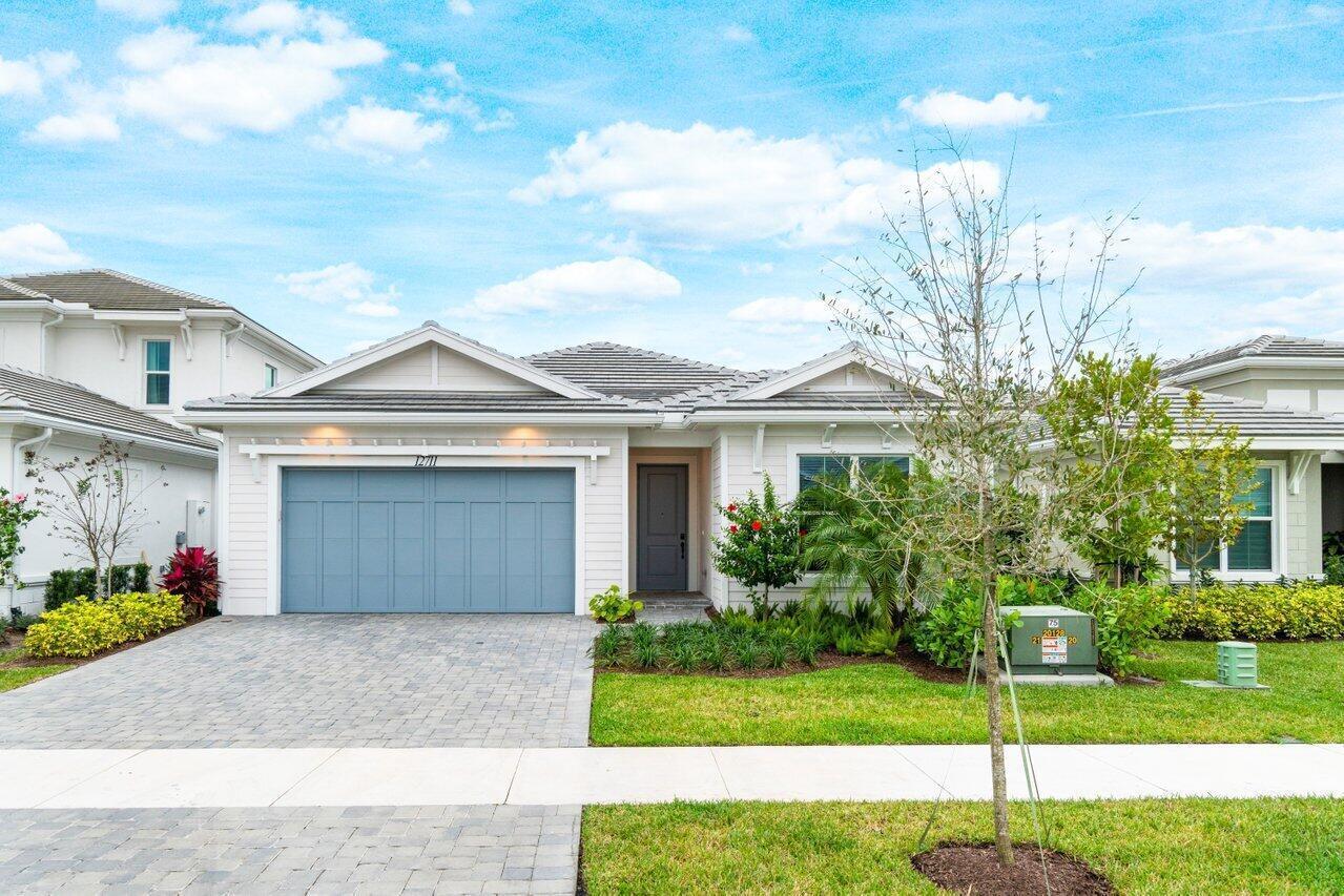 Welcome to Windgate at Avenir, an exclusive community in the heart of Palm Beach Gardens. Experience the finest in new construction with this stunning home. Offering 4 bedrooms, and 3 bathrooms, this spacious residence spans 2,560 square feet of thoughtfully designed living space. The luxurious primary suite ensures ultimate comfort and privacy. You'll find three additional bedrooms, and high-end finishes throughout, including stainless steel appliances, a gas stovetop, and tile floors. Outside, the beautifully landscaped backyard features an inviting pool, outdoor kitchen and stunning views of the tranquil lake.Residents of Avenir enjoy access to world-class amenities such as a fully equipped fitness center, tennis and pickleball courts, playground and much more.
